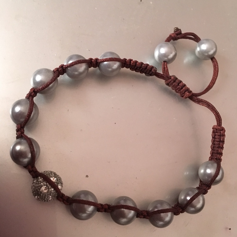 greyish faux pearl bracelet ties at end
